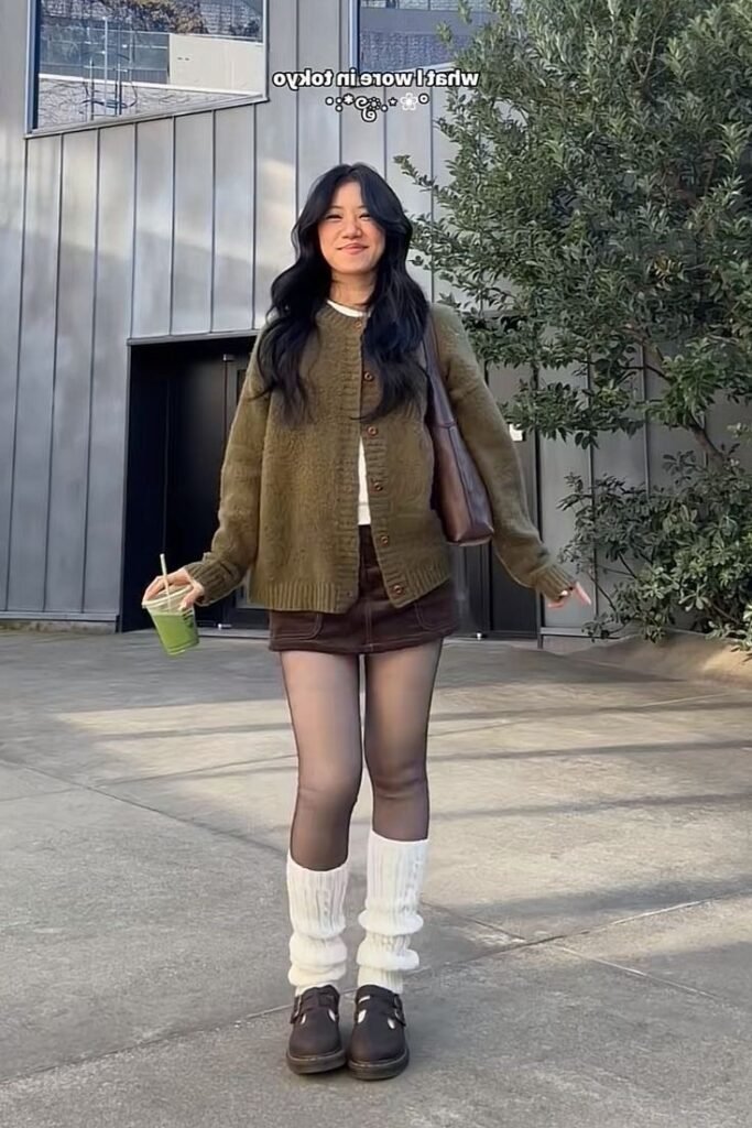 Olive Green Knit Cardigan + Brown Denim Mini Skirt + White Leg Warmers + Dark Brown Mary Jane Shoes