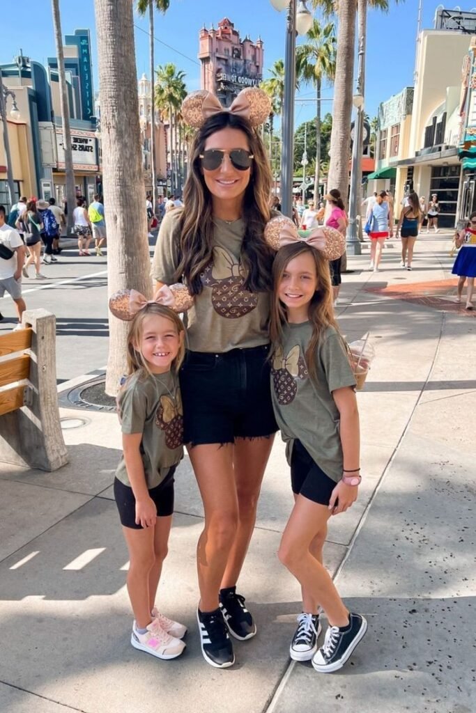 Olive Green Minnie Graphic Tee + Black Denim Shorts + Black and White Sneakers