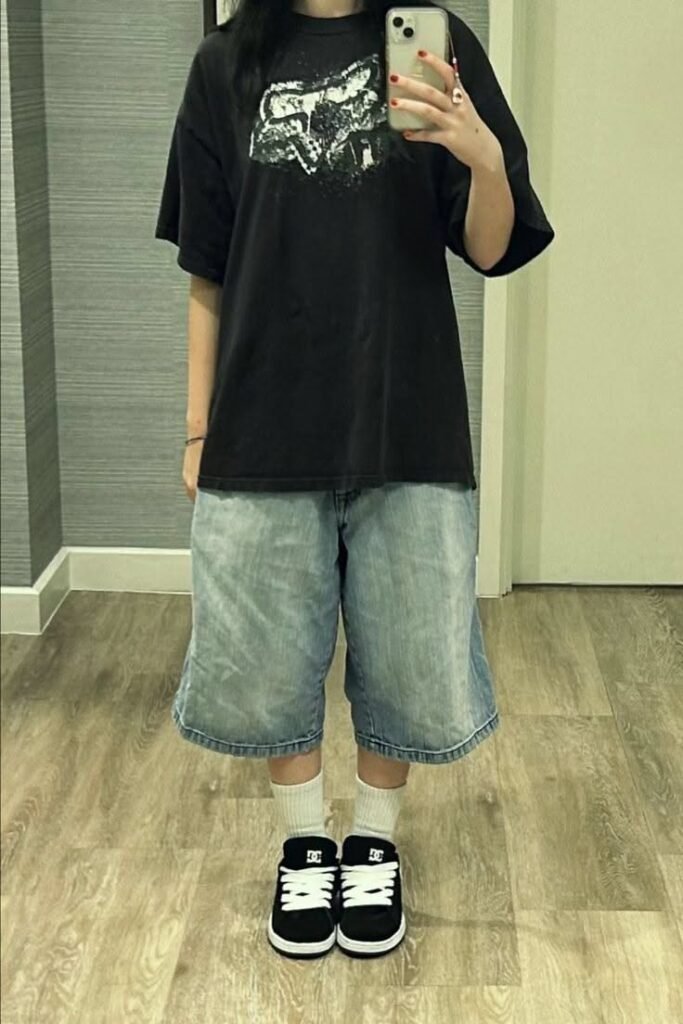 Oversized Black Graphic T-Shirt + Light Wash Denim Jorts + Black and White Skate Shoes
