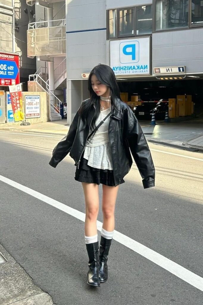 Oversized Black Leather Jacket + Asymmetrical Cream Top + Black Ruffled Mini Skirt + Black Mid Calf Leather Boots
