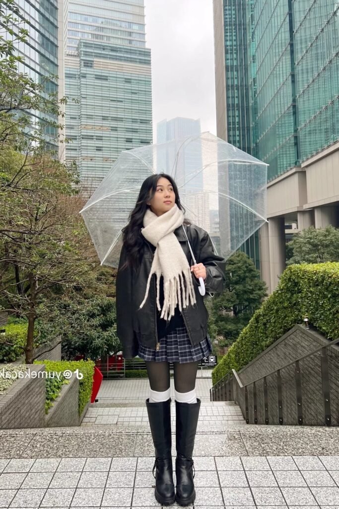 Oversized Black Leather Jacket + White Fringe Scarf + Plaid Mini Skirt + Knee High Black Boots