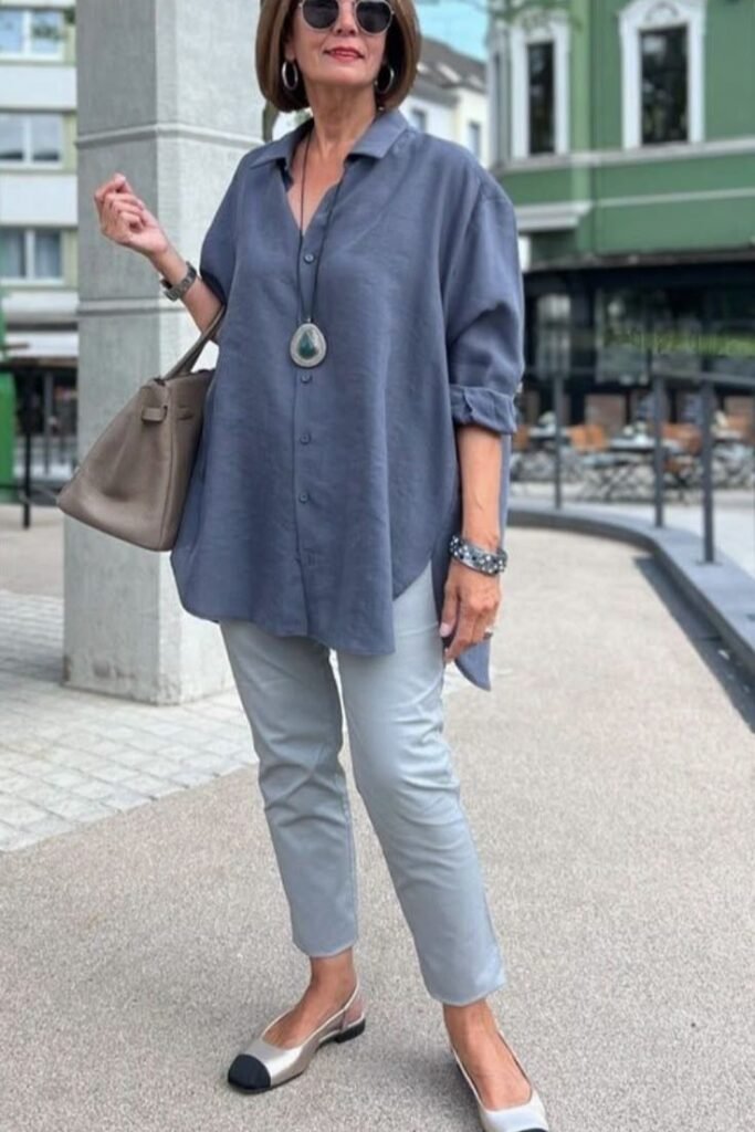Oversized Slate Blue Button-Down + Light Grey Tapered Pants + Silver Cap-Toe Flats