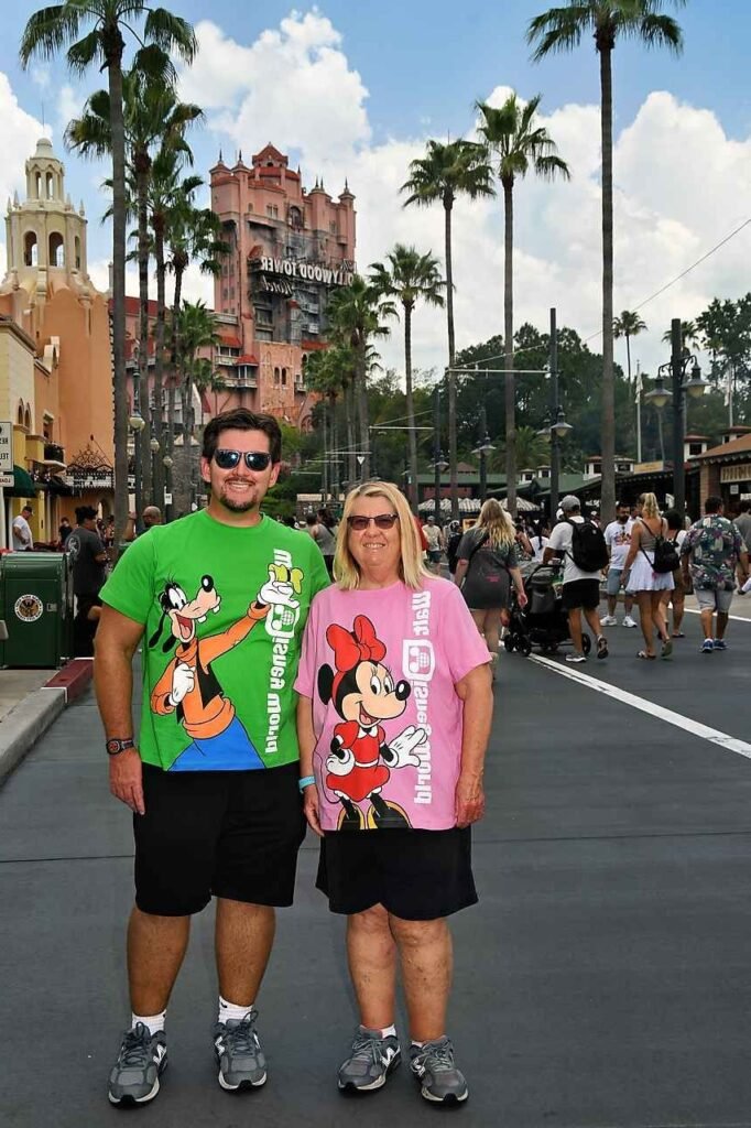 Pink Graphic Minnie Mouse Tee + Black Relaxed Fit Shorts + Grey Running Shoes