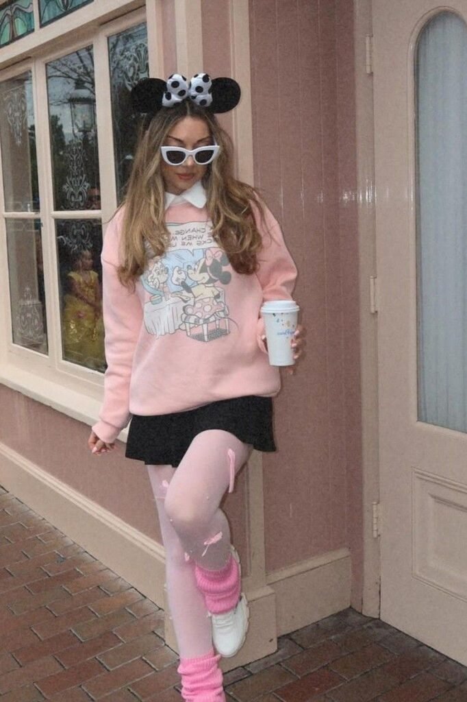 Pink Graphic Sweatshirt with White Collar + Black Mini Skirt + Pink Tights with Leg Warmers + White Sneakers