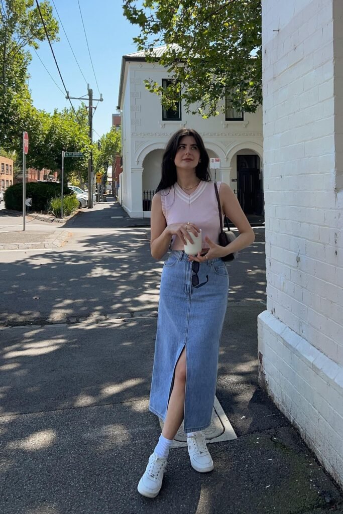 Pink V Neck Sweater Vest + Light Wash Denim Maxi Skirt with Front Slit + White Socks + White Sneakers