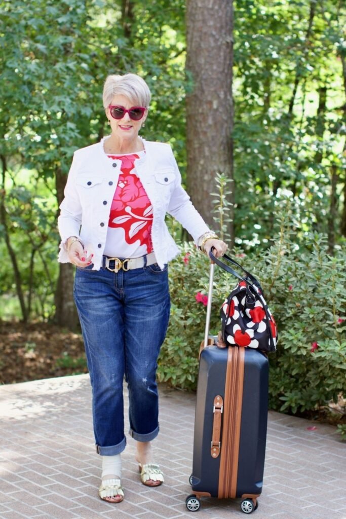 Red Floral Print Top + White Frayed Denim Jacket + Dark Wash Cuffed Jeans + Gold Fringe Mules