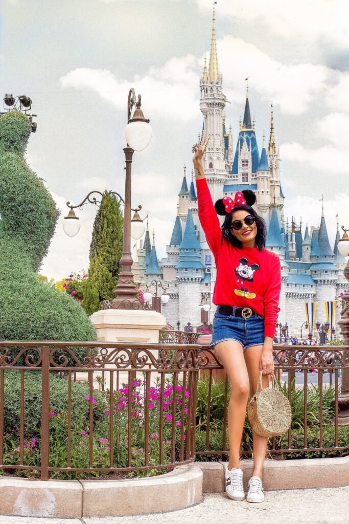 Red Mickey Mouse Sweatshirt + Denim Shorts + White Sneakers