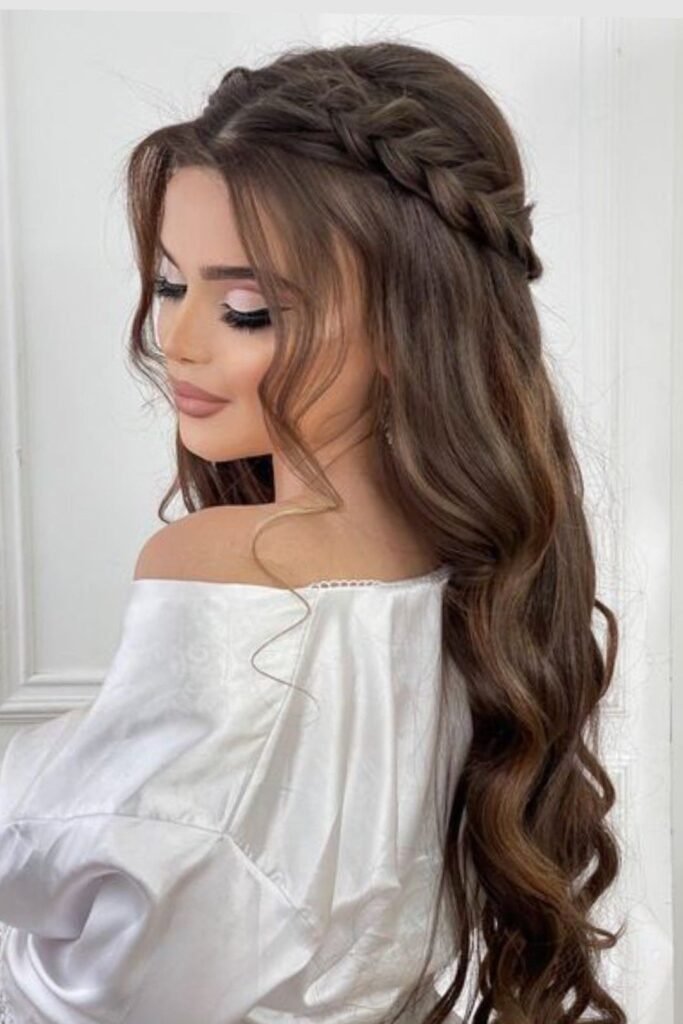 Side-Swept Braid with Long Voluminous Brunette Curls