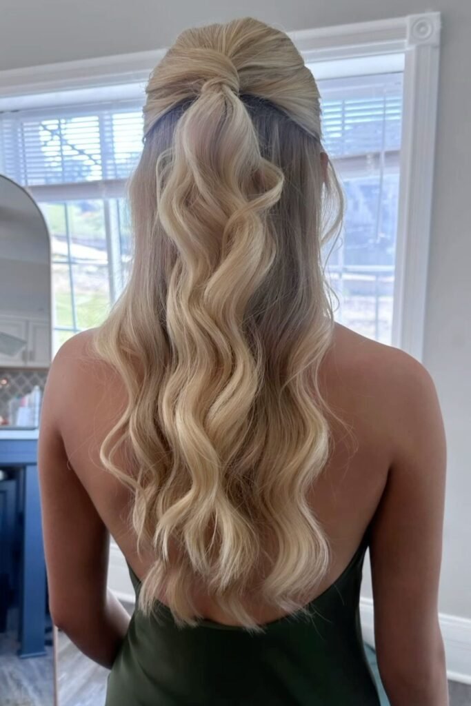 Sleek Half-Up Ponytail with Voluminous Waves