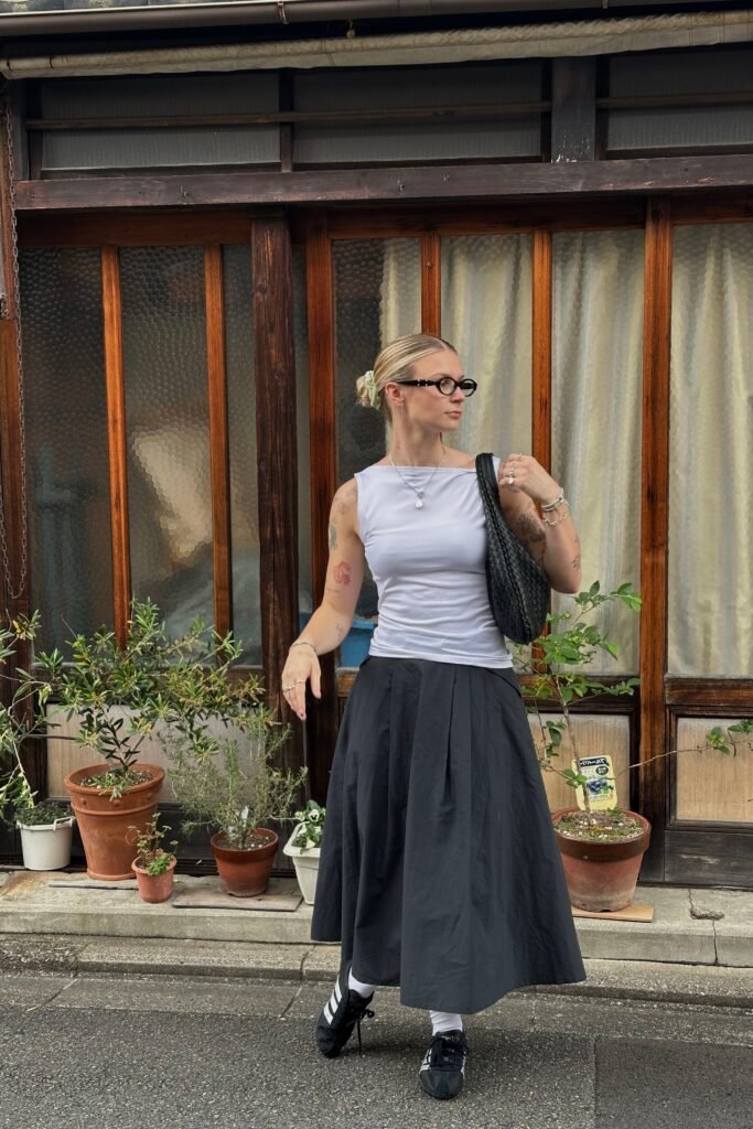 Sleeveless White Top + Pleated Dark Grey Midi Skirt + Black Sneakers with White Socks
