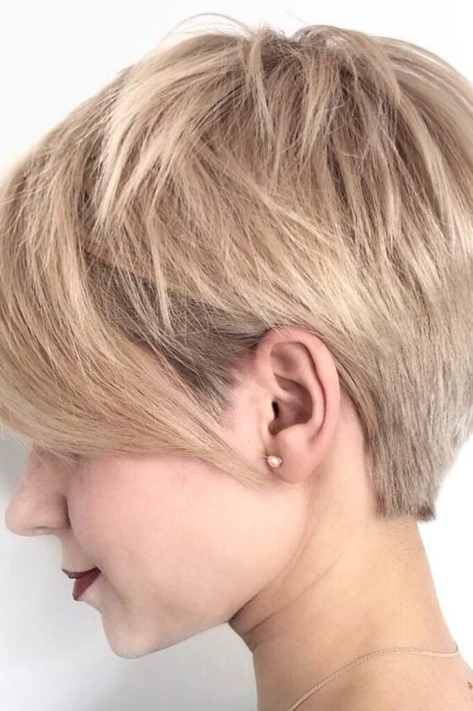Soft Sandy Blonde Pixie with Tapered Nape and Side-Swept Fringe