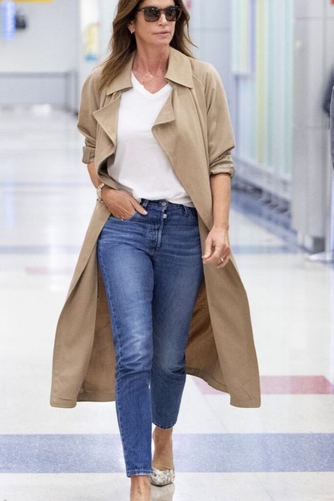 Tan Trench Coat + White V Neck T Shirt + Medium Wash Slim Jeans + Snakeskin Print Heels