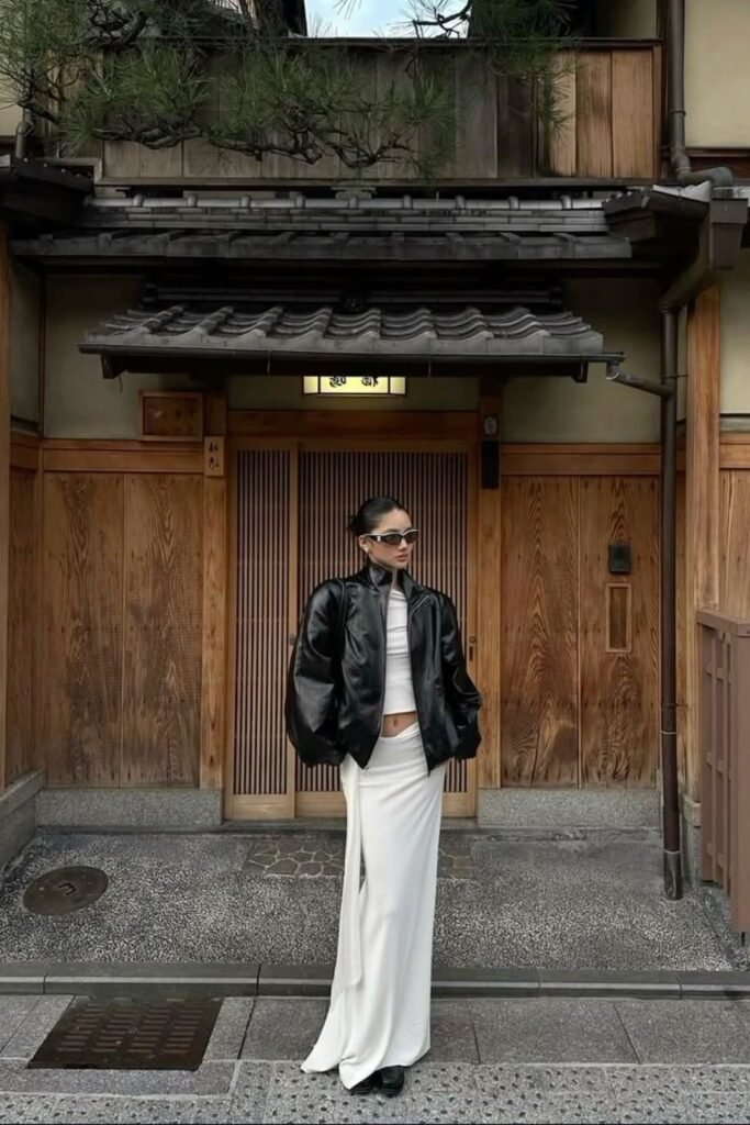 Voluminous Black Bomber Jacket + White Crop Top + White Maxi Skirt + Black Shoes