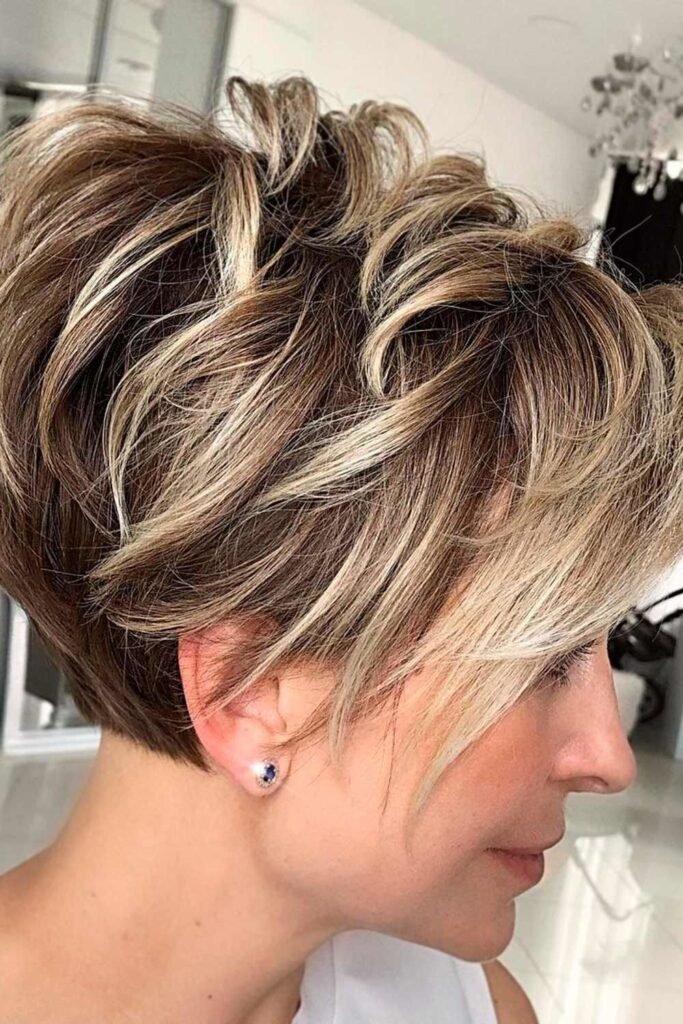 Voluminous Layered Pixie with Honey Blonde Highlights