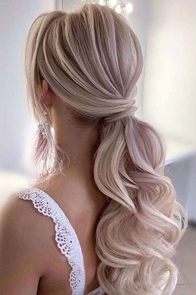 Voluminous Wavy Ponytail with Wrapped Base in Ash Blonde