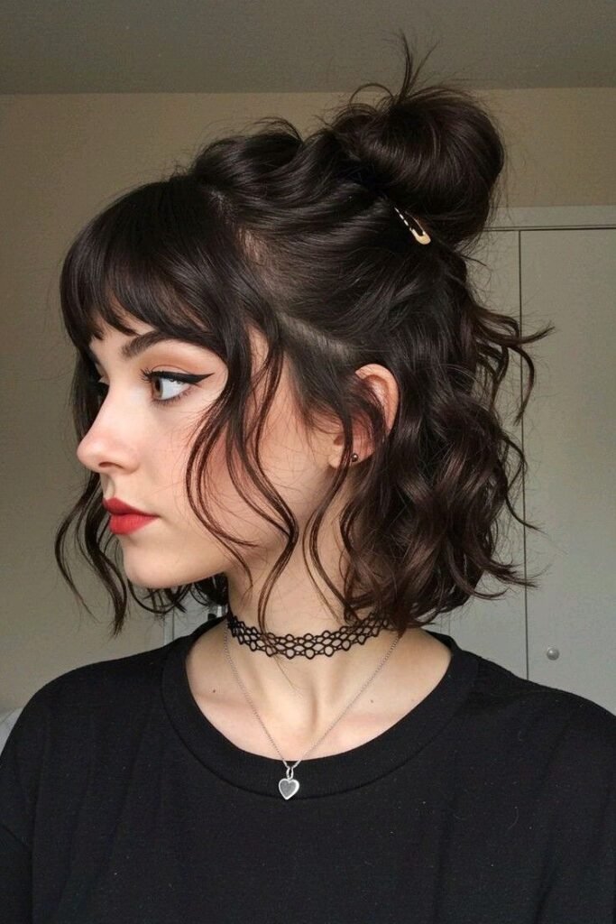 29. Wavy Half-Up Bun with Bangs