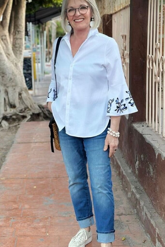 White Button Up Shirt with Embroidered Sleeves + Medium Wash Cuffed Jeans + White Sneakers