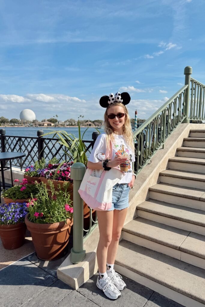 White Character Graphic T Shirt + Light Wash Denim Shorts + White Athletic Sneakers