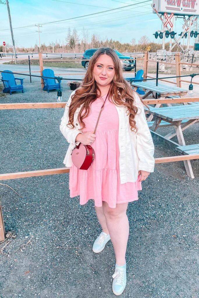 White Corduroy Jacket + Pink Tiered Dress + Heart Shaped Crossbody Bag + White Sneakers