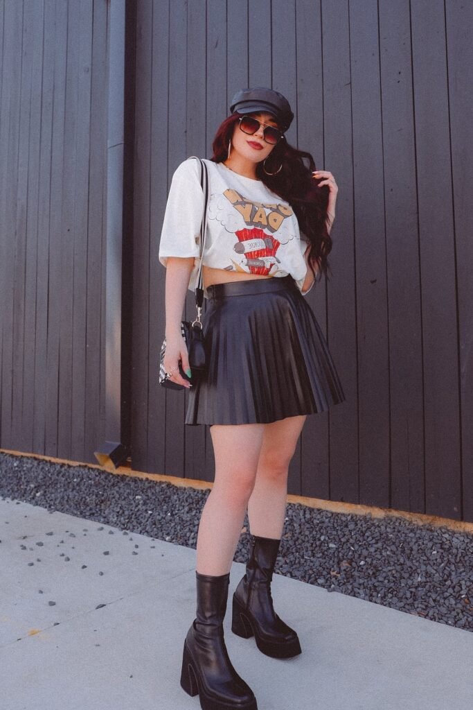 White Crop Graphic T Shirt + Black Pleated Skirt + Black Leather Cabbie Hat + Black Mid Calf Platform Boots