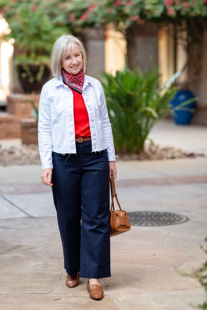 White Denim Jacket + Red Crewneck Top + Navy Wide Leg Trousers + Red Neck Scarf + Brown Leather Loafers