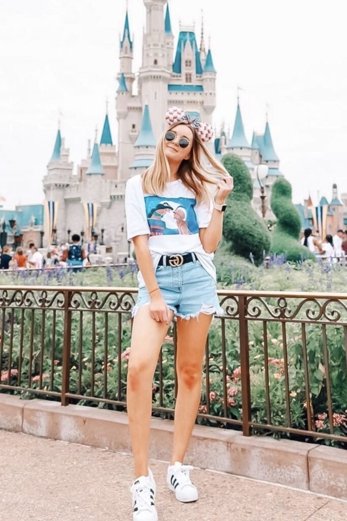White Disney Graphic T Shirt + Light Wash Distressed Denim Shorts + White Sneakers with Black Stripes