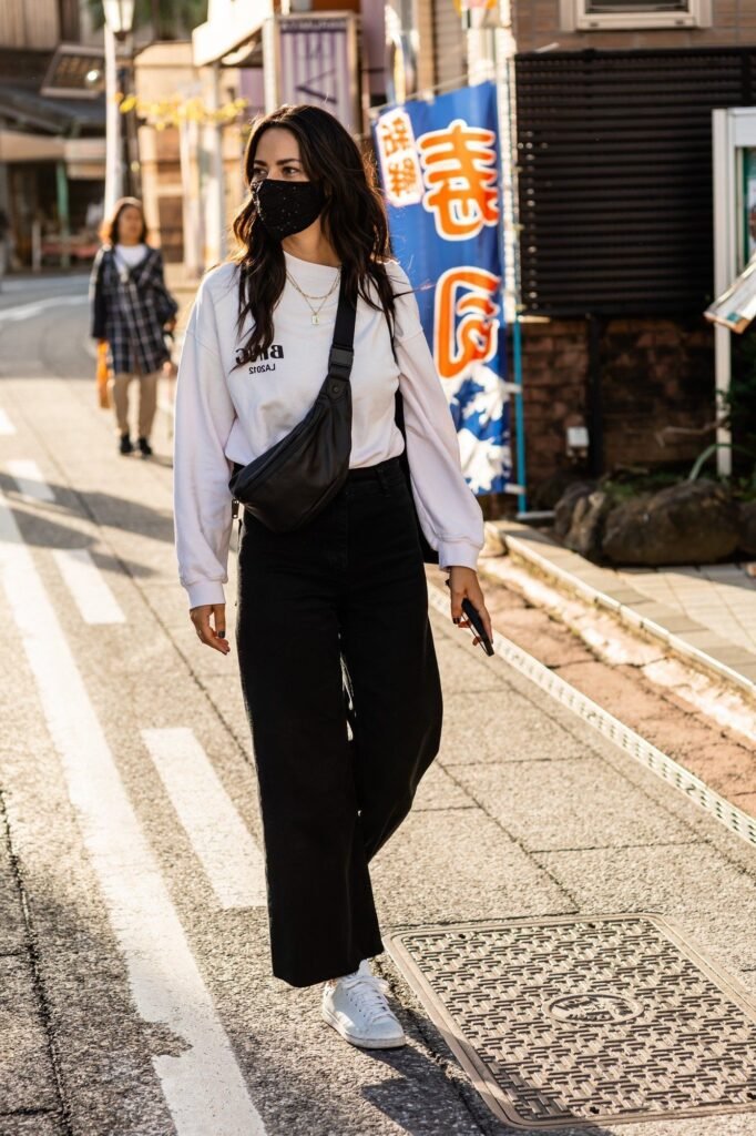 White Graphic Sweatshirt + Black Wide Leg Jeans + White Sneakers
