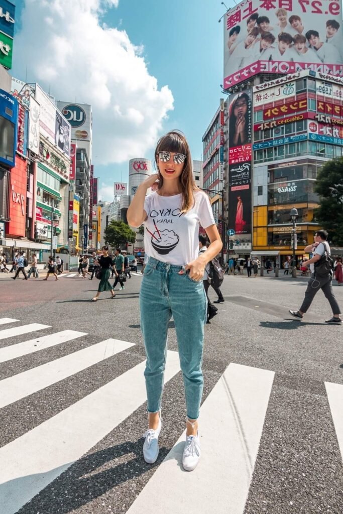 White Graphic T Shirt + Light Blue Mom Jeans + White Sneakers