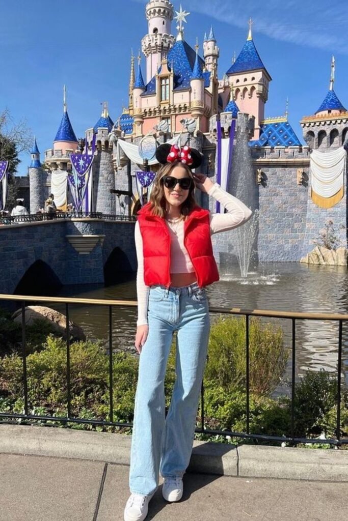White Long Sleeve Crop Top + Red Puffer Vest + Light Blue Wide Leg Jeans + White Sneakers