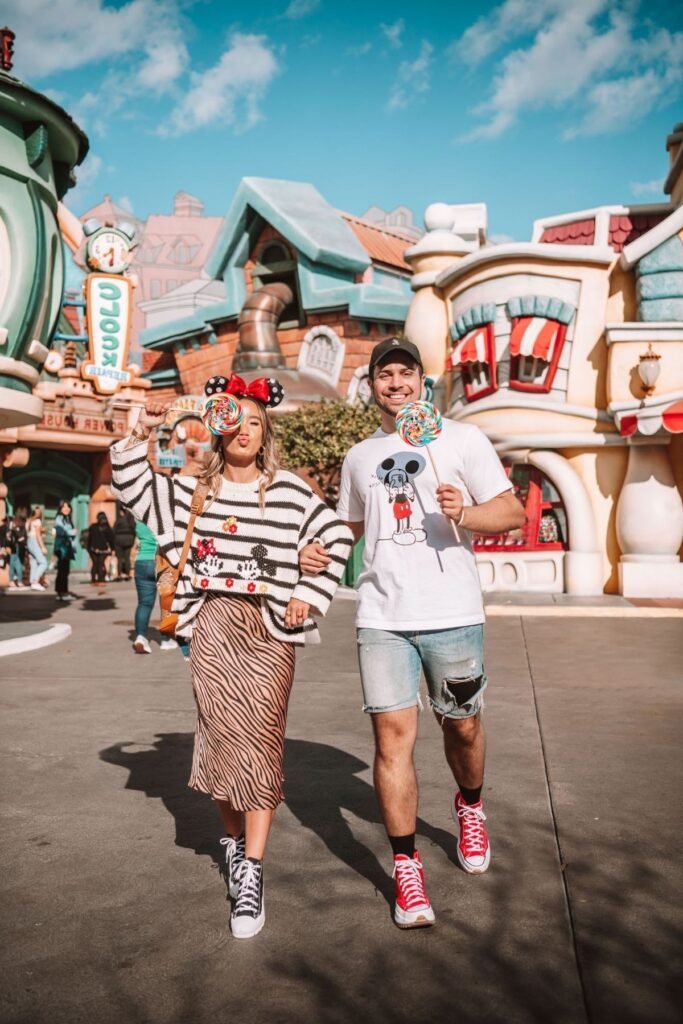 White Mickey Graphic T Shirt & Black and White Striped Mickey Sweater + Distressed Denim Shorts & Tiger Print Midi Skirt + Red High Top Sneakers & Black and White High Top Sneakers
