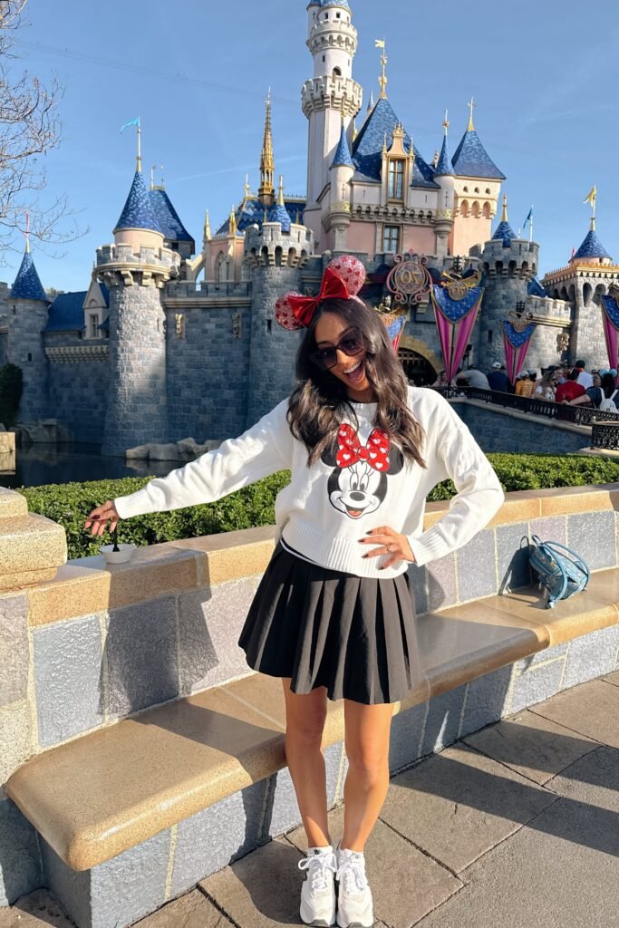 White Minnie Mouse Knit Sweater + Black Pleated Mini Skirt + White Sneakers