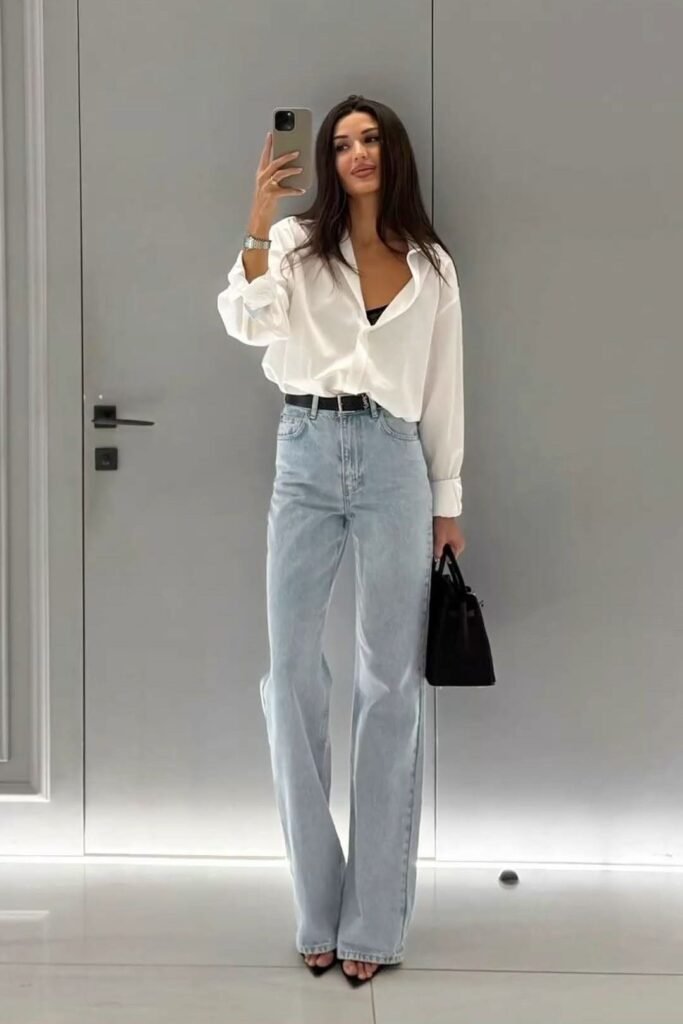 White Oversized Button Down Shirt + Light Wash Wide Leg Jeans + Black Heeled Sandals