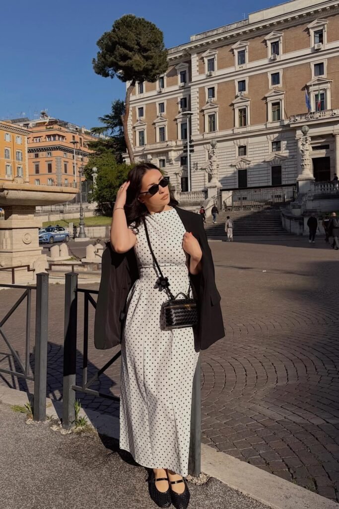 White Polka Dot Maxi Dress + Black Blazer Over Shoulders + Black Woven Mary Jane Flats