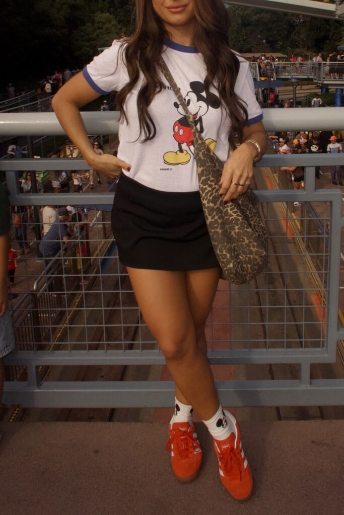 White Ringer Mickey Mouse Tee + Black Mini Skirt + Bright Orange Sneakers with Graphic Socks
