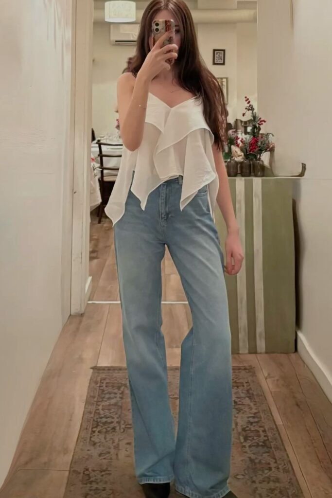 White Ruffled Cami Top + Light Wash Wide Leg Jeans + Black Boots