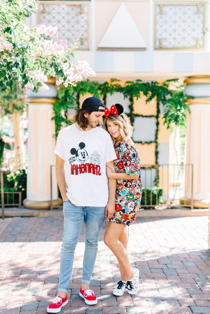 White Shanghai Mickey T Shirt & Colorful Character Print T Shirt Dress + Light Wash Skinny Jeans + Red Sneakers & White Patterned Sneakers