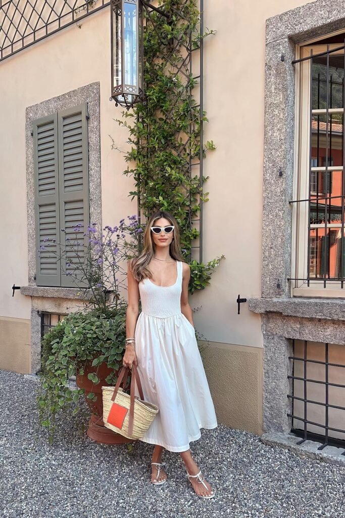 White Smocked Midi Dress + White Cat Eye Sunglasses + Straw Tote Bag with Orange Leather Patch + White T Strap Sandals