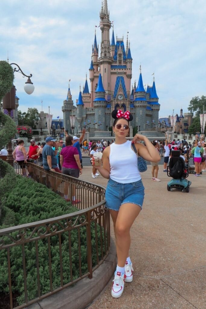 White Tank Top + Denim Shorts + White and Red Sneakers