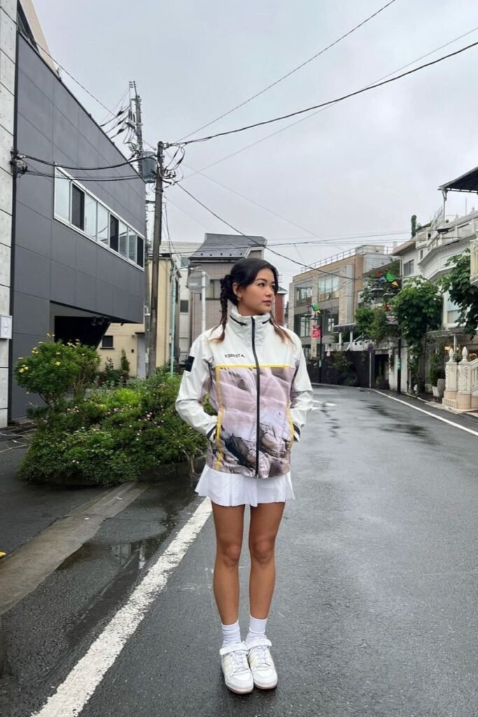 White and Patterned Zip Up Windbreaker Jacket + White Pleated Mini Skirt + White Socks + White Sneakers