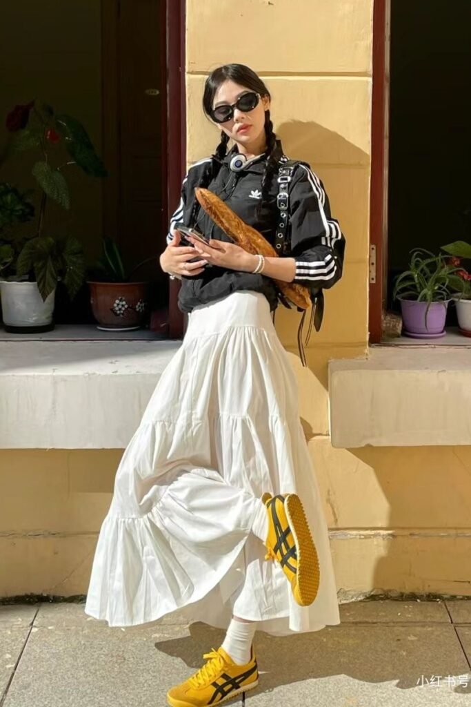 Black Striped Track Jacket + White Tiered Skirt + Yellow Sneakers