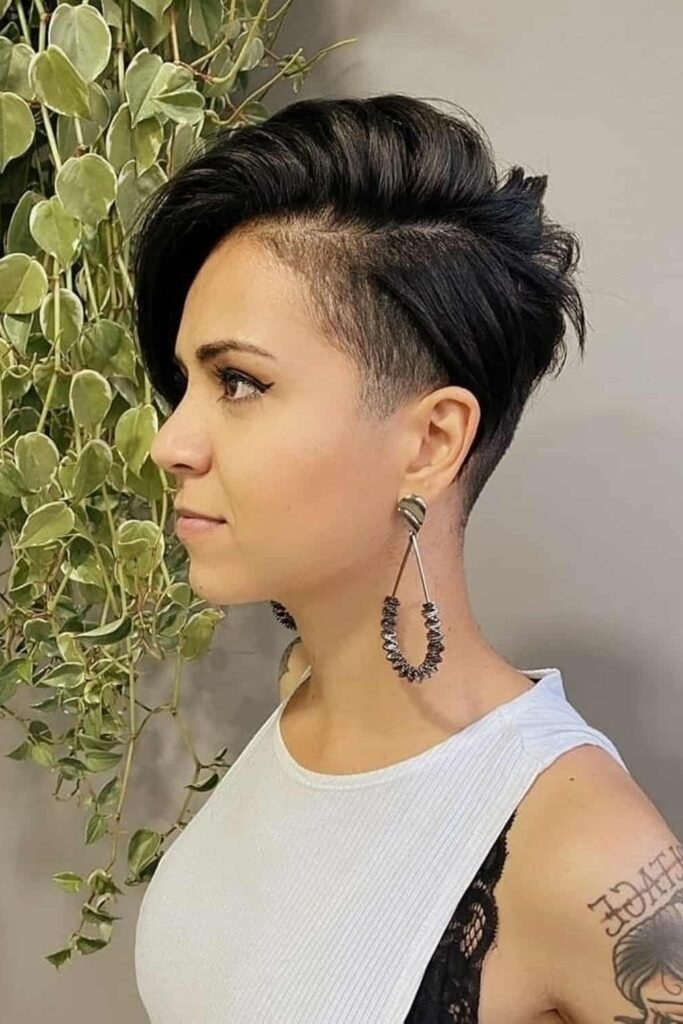 62. Bold Dark Pixie Cut with Side-Swept Bangs and Undercut