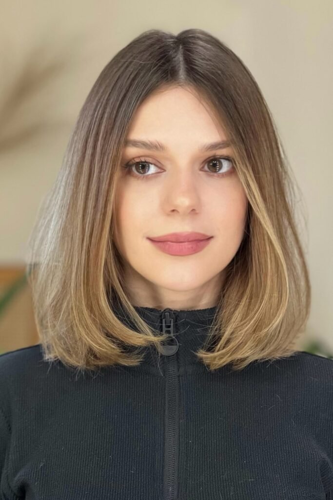 Classic Mid-Length Cut with Subtle Highlights