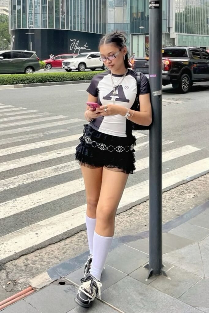 Graphic Baby Tee + Black Tiered Mini Skirt + Black Sneakers