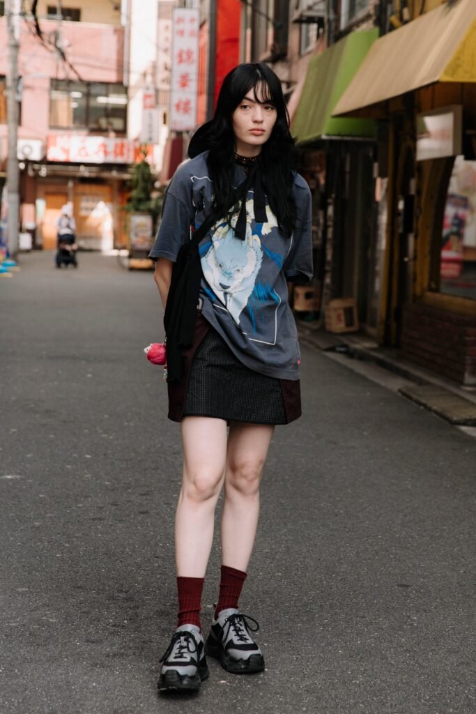 Grey Graphic T Shirt + Black Mini Skirt + Grey Sneakers