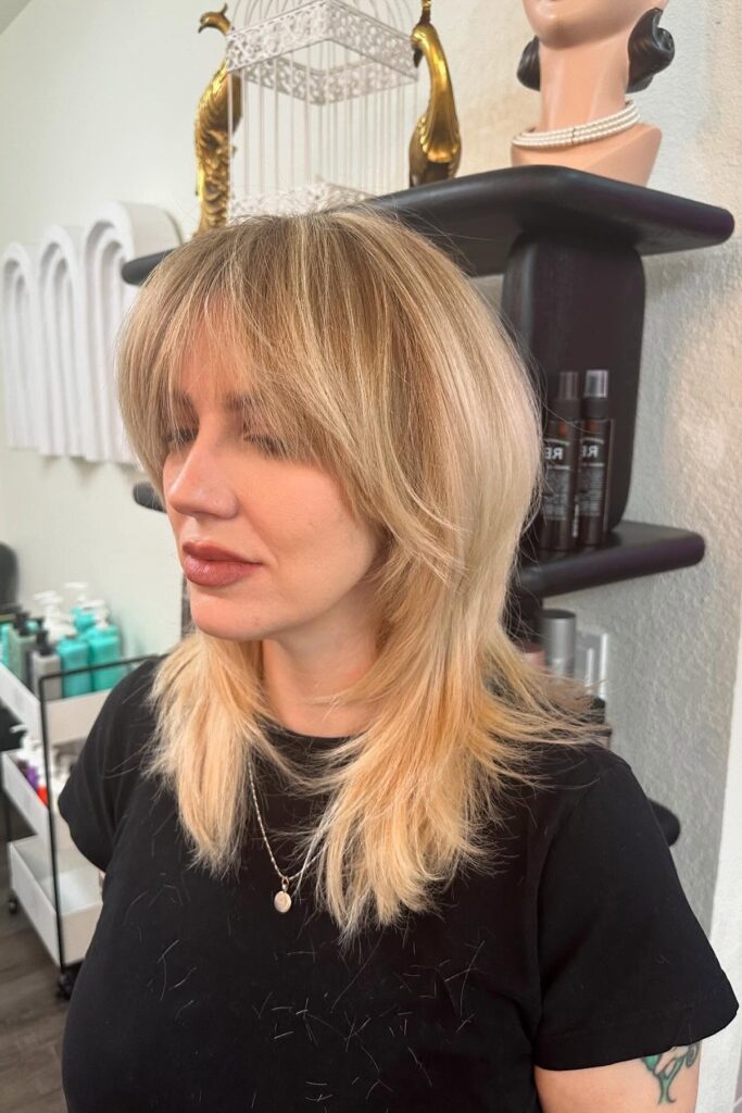 36. Honey Blonde Shag with Dynamic Face-Framing Layers