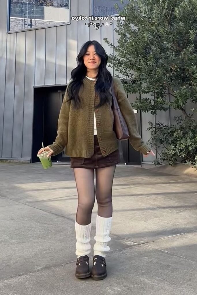 Olive Green Cardigan + Brown Mini Skirt + Black Stockings + Leg Warmers + Brown Shoes