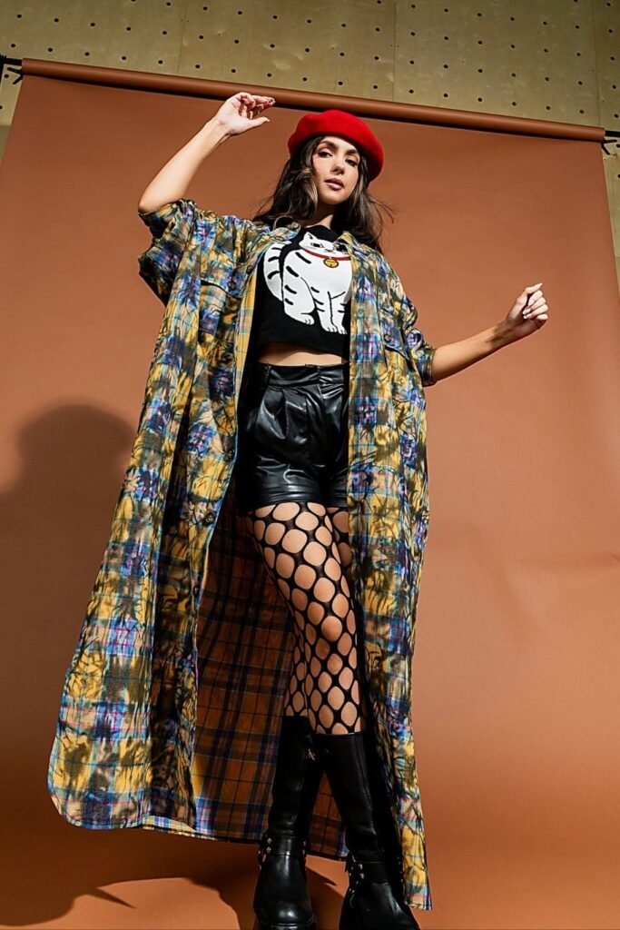 Red Beret + Cat Graphic Crop Top + Leather Shorts + Fishnet Tights + Long Plaid Duster + Black Boots