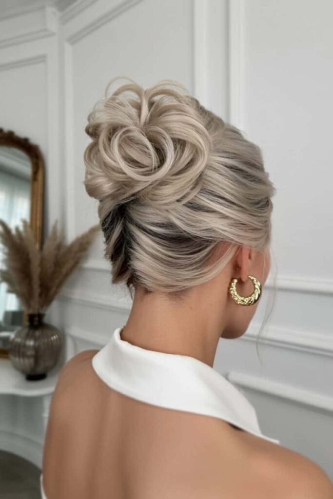 Sculpted High Updo with Side-Swept Details