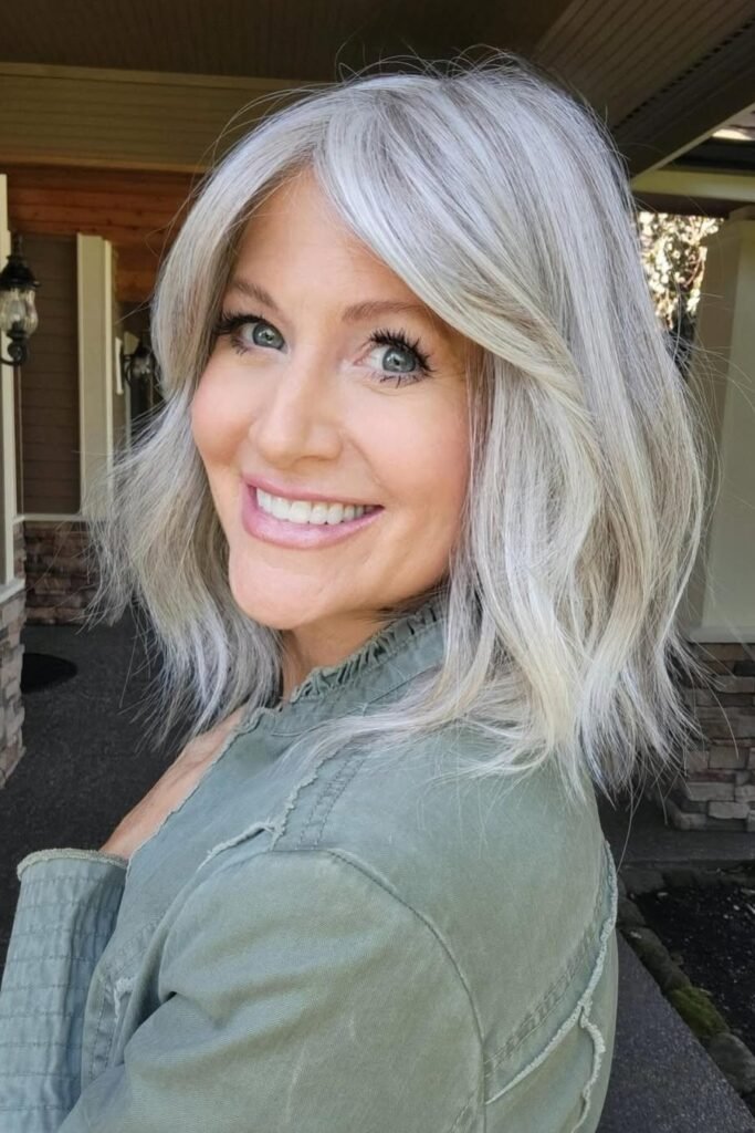 Shoulder-Length Layered Cut with Soft Curtain Bangs