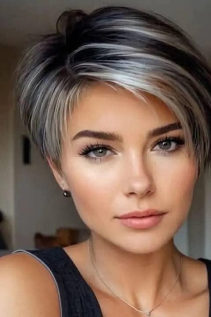 43. Sleek Layered Pixie with Silver Highlights